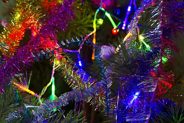 Christmas background of tinsel and garland — Zdjęcie stockowe