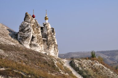 Cave Orthodox church in Russia. clipart