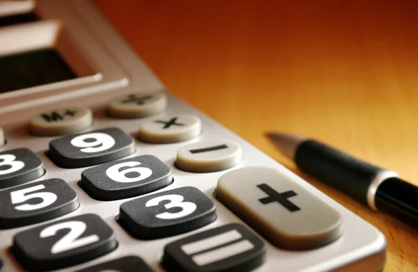Calculator on a desk and a place for your text — Stock Photo, Image
