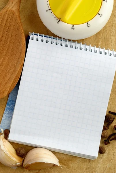 stock image Notebook for recipes and vegetables on the table