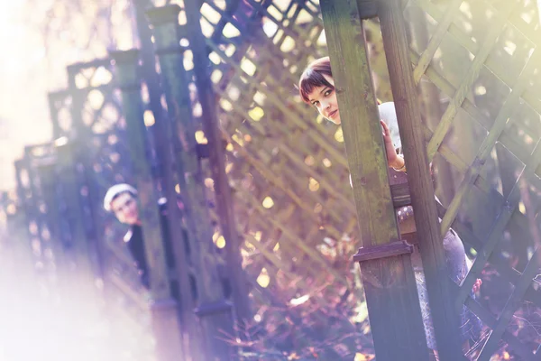 stock image Lovers hiding in the autumn park