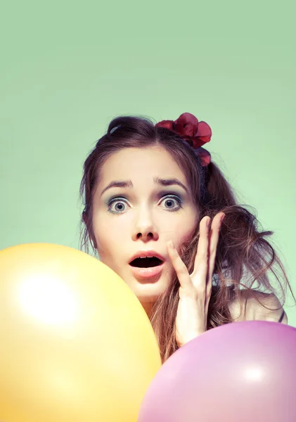 Wondered girl with balloons — Stock Photo, Image