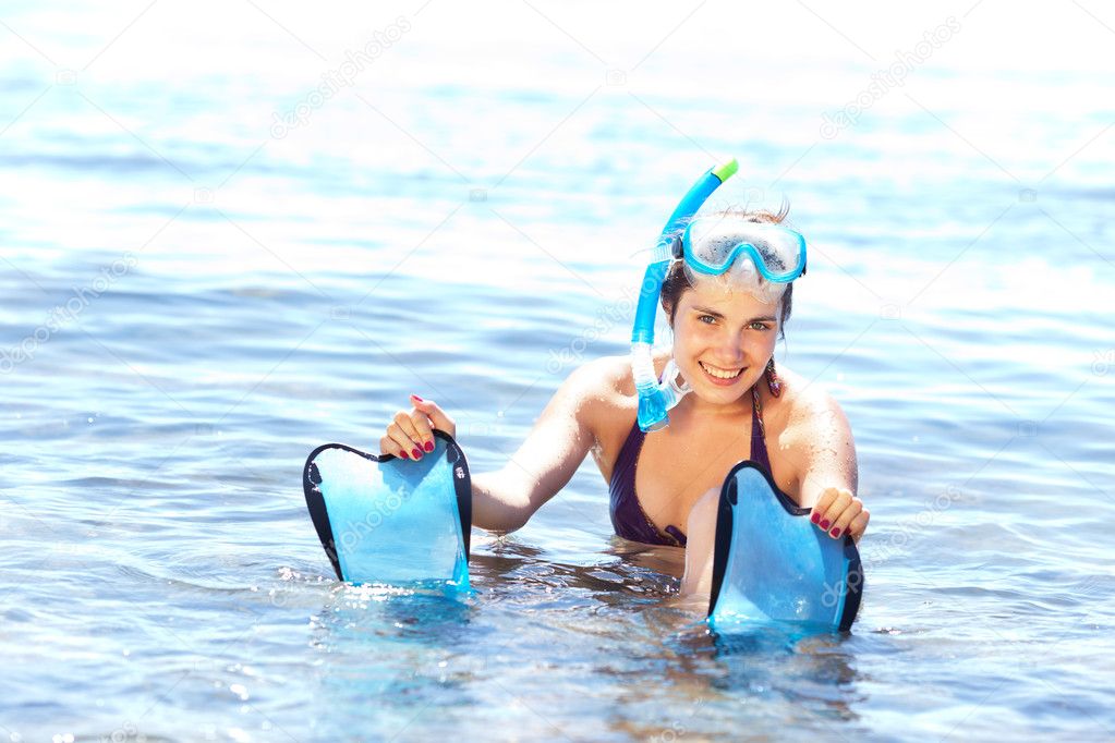 Girl with snorkel equipment