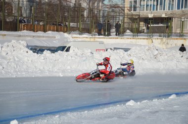 Ice Speedway, two rival motorcyclists on corner exit