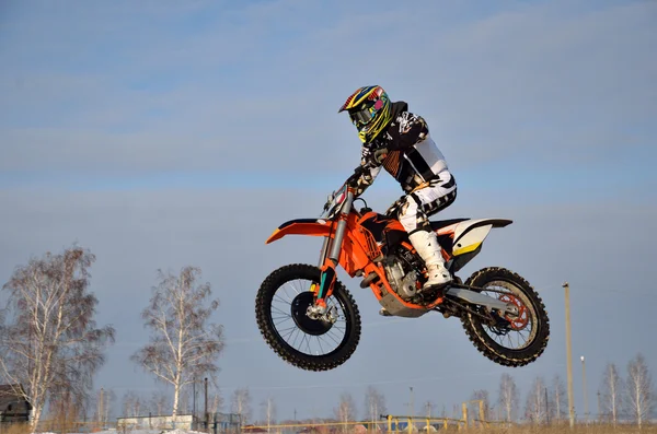 Motocross racer performs a jump efficient — Stock Photo, Image