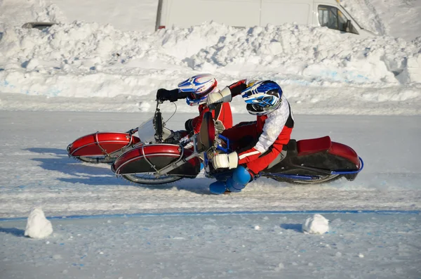 Eisschnelllauf, zwei Athleten drehen sich Stockbild