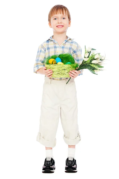 Little boy with easter eggs and flowers — Stock Photo, Image