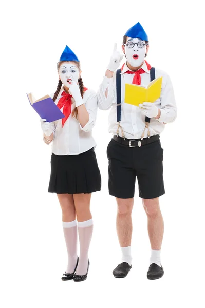 Studio shot of funny mimes with books — Stock Photo, Image