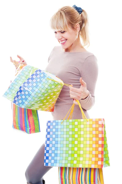 Studio shot of young woman after shopping — Stock Photo, Image