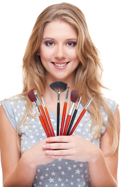 Young beautiful model with brushes — Stock Photo, Image
