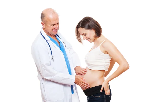 Studioaufnahme von Smiley schwangere Frau und Arzt — Stockfoto