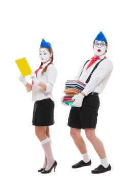 Studio shot of funny actors with books clipart