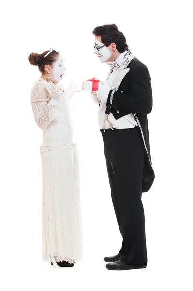 Studio shot of funny mimes with present — Stock Photo, Image