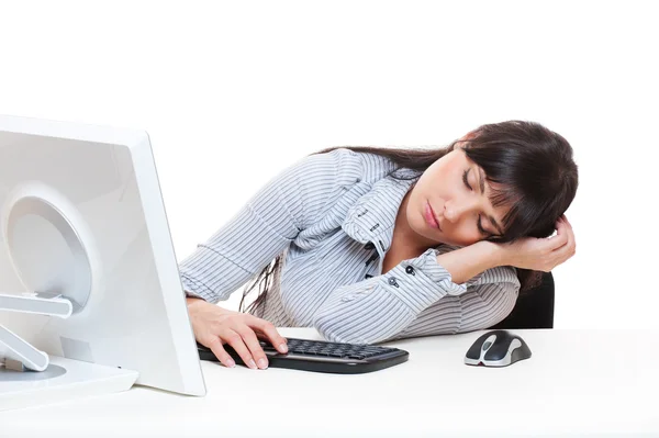 Joven secretaria durmiendo en su lugar de trabajo — Foto de Stock