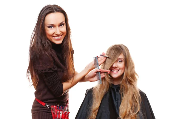 Studio picture of hairdresser doing haircut — Stock Photo, Image