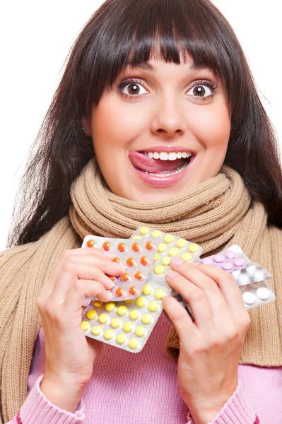 Studio shot of funny woman with pills — Stock Photo, Image