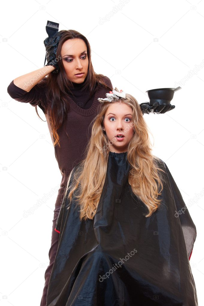 Studio shot of hairdresser and shocked client