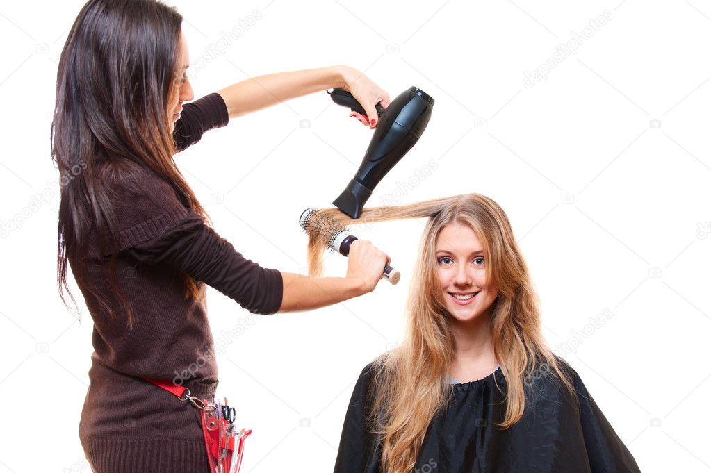 Studio shot of hairdresser with hairdryer
