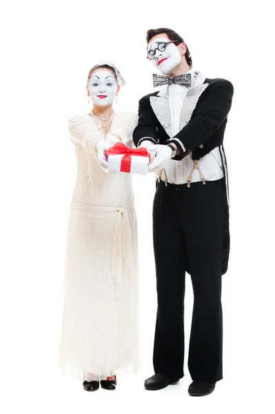 Two funny mimes with gift box in studio on white — Stock Photo, Image