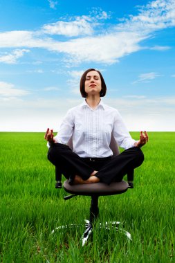 Businesswoman sitting in lotus position clipart