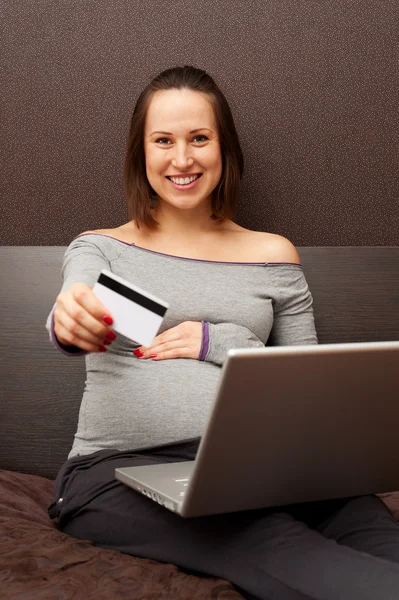 Happy pregnant woman with plastic card — Stock Photo, Image