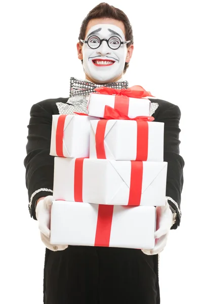 Mime holding many boxes of presents — Stock Photo, Image