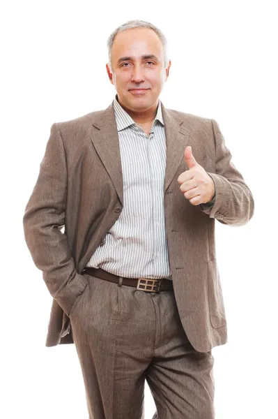Homem de negócios de terno mostrando polegares para cima — Fotografia de Stock