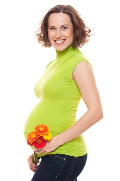 Gravid kvinna med blommor — Stockfoto