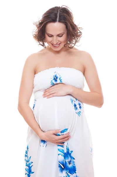 Mulher grávida olhando para a barriga — Fotografia de Stock