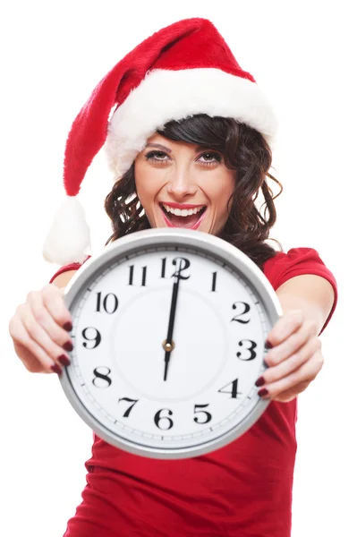 Excited girl with santa hat holding clock — Stock Photo, Image