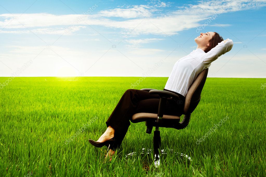 Businesswoman relaxing on chair