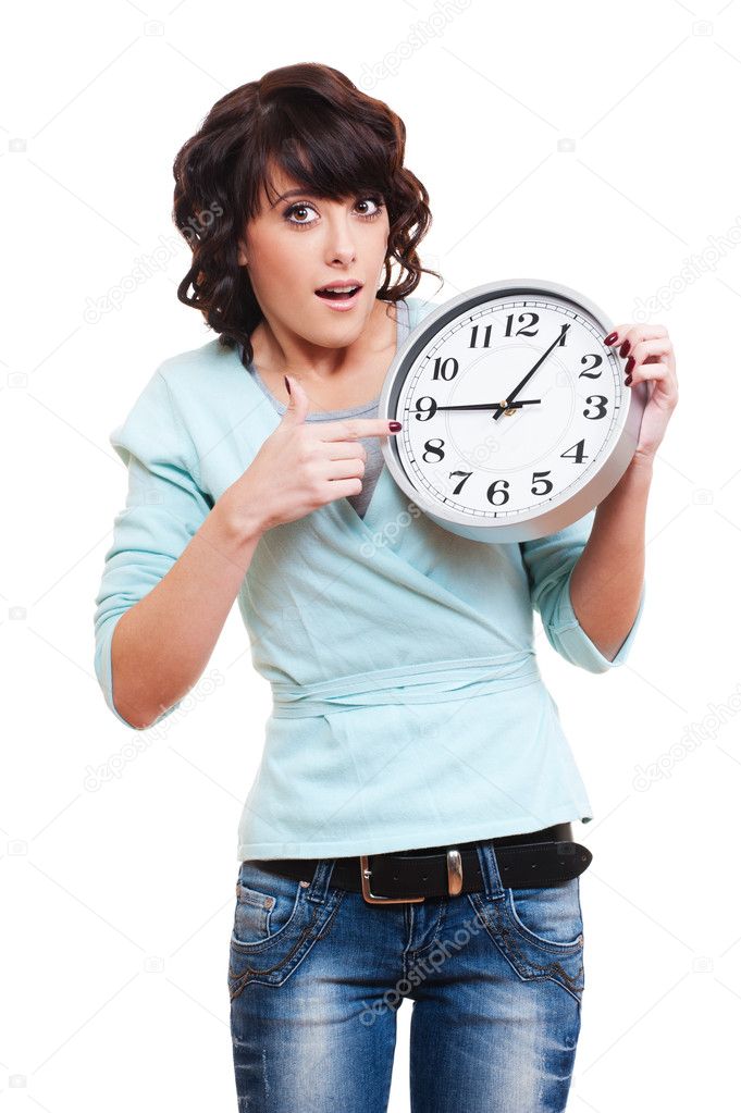 Amazed woman with clock