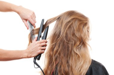 Hairdresser straightening hair clipart