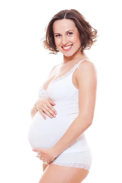 Mulher grávida em lingerie branca — Fotografia de Stock