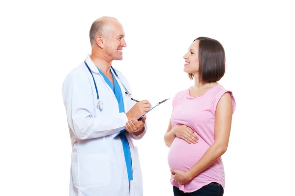 Mujer embarazada y médico conversando — Foto de Stock