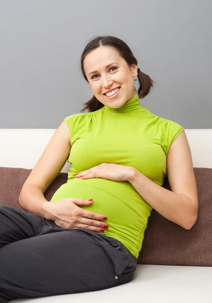 Pregnant woman hug her belly Stock Picture