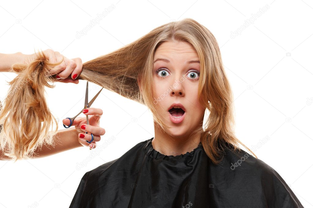 Amazed woman with long hair and scissors