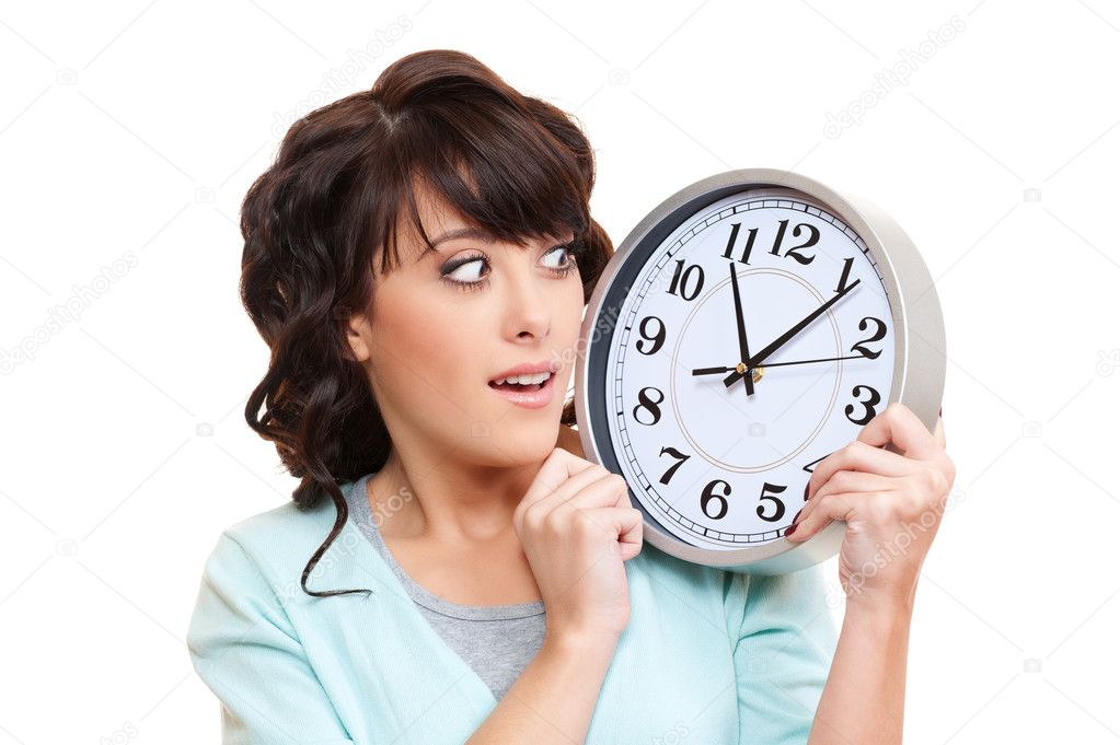 Shocked woman with clock