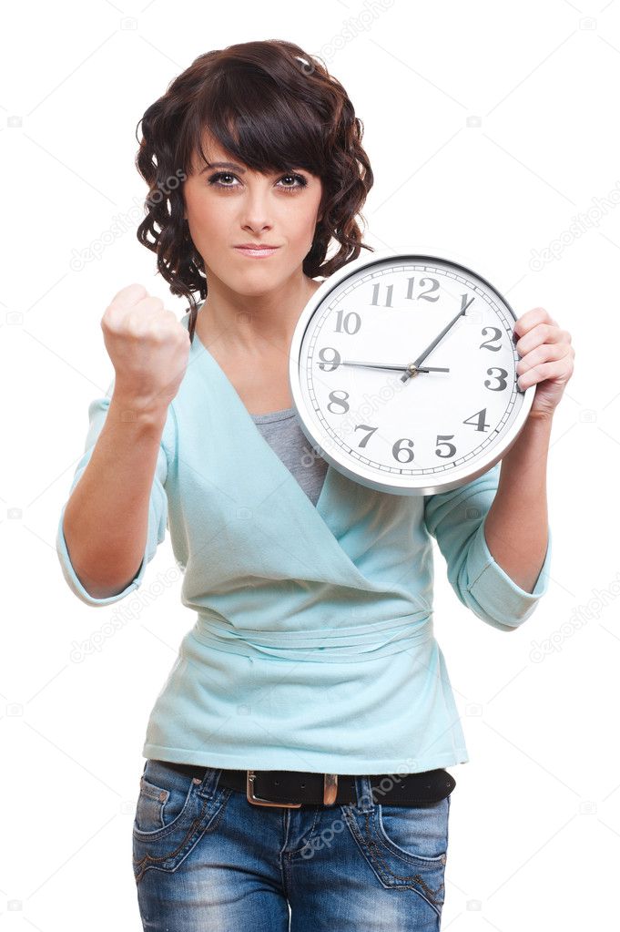 Strict young woman holding clock