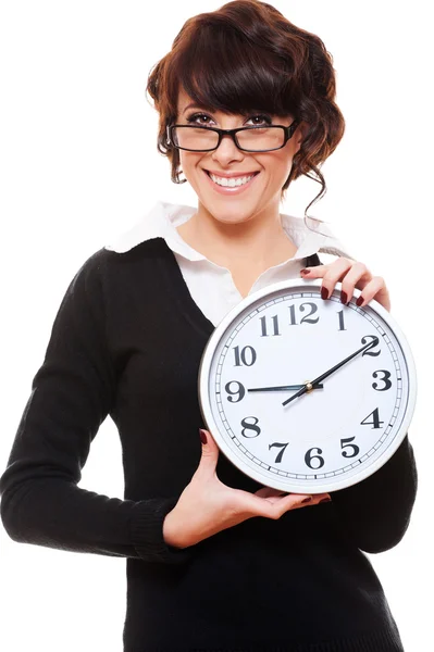 Businesswoman holding clock Stock Photo