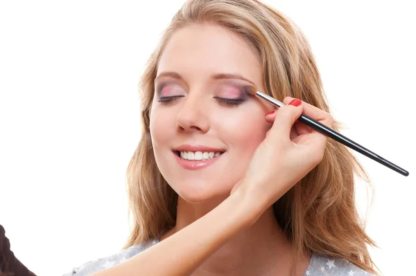 Studio shot of lovely young woman having make up — Stock Photo, Image