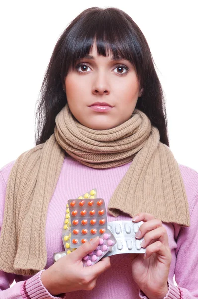 Young woman holding pills — Stock Photo, Image