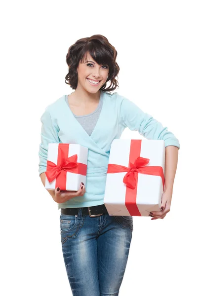 Веселая женщина с подарками над белым — стоковое фото