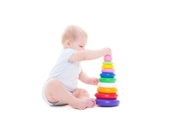 Dítě s hračkou nad bílá — Stock fotografie