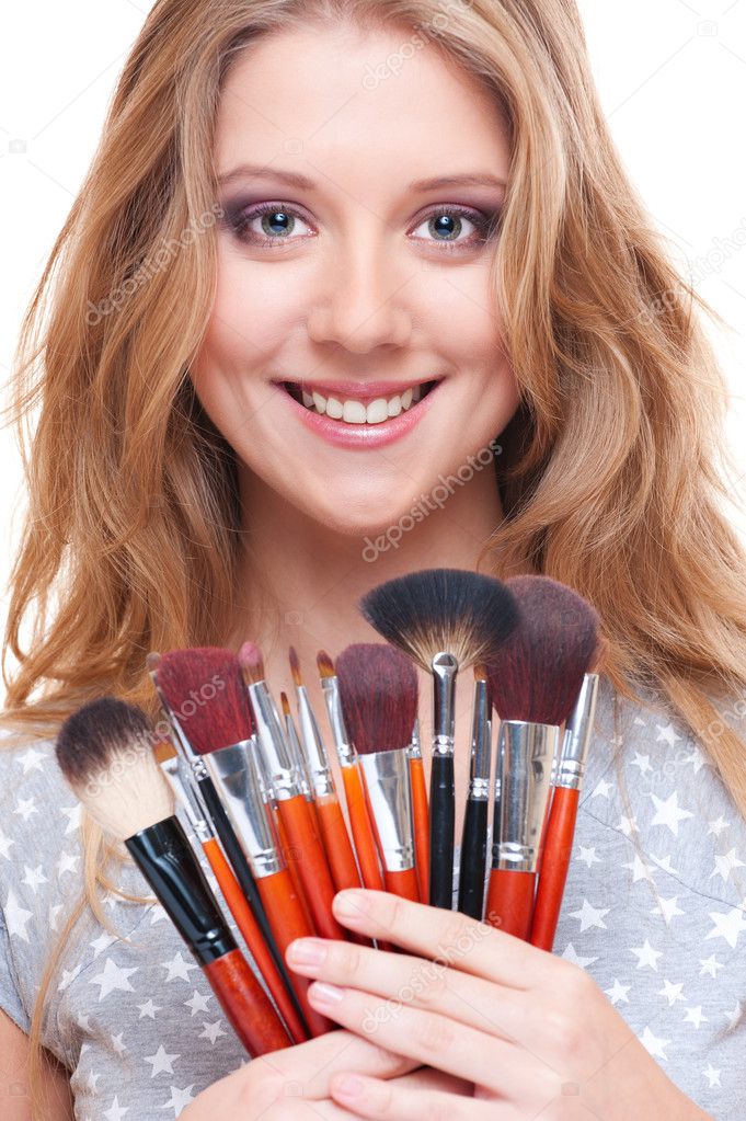 Smiley woman with make-up tools