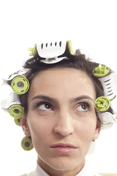 Mulher séria com caracóis no cabelo — Fotografia de Stock