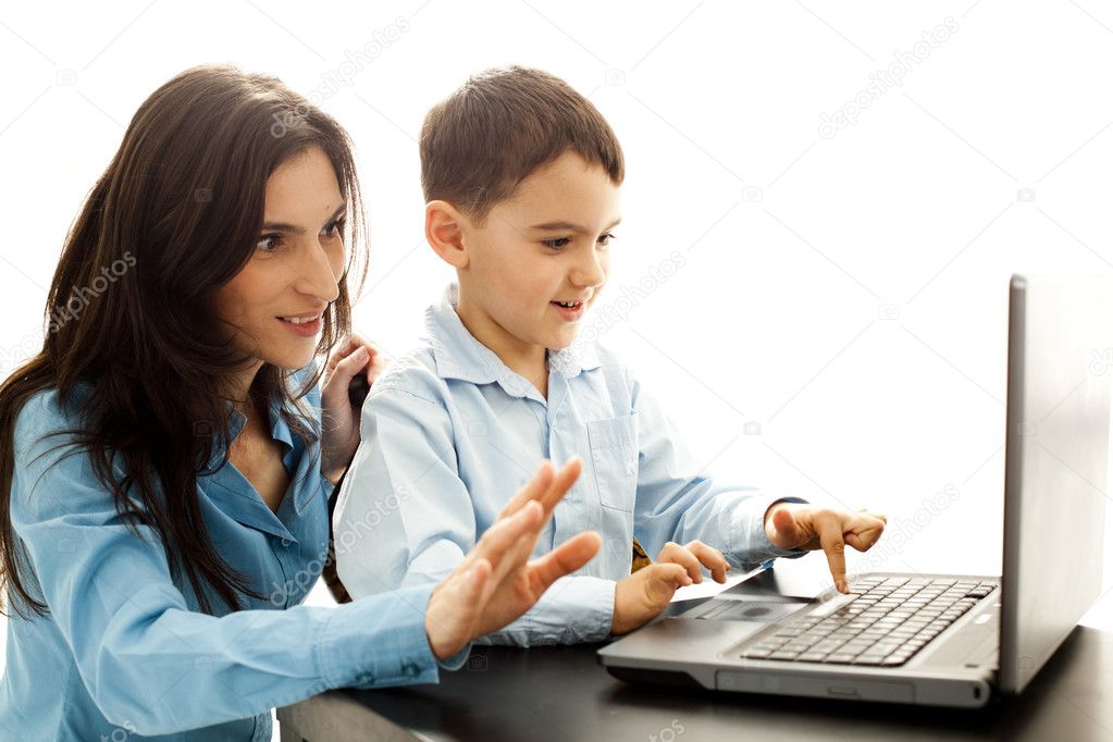 Happy child learning typing