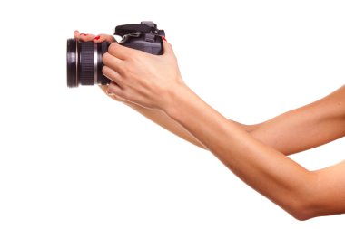 Women's hands holding the camera. clipart