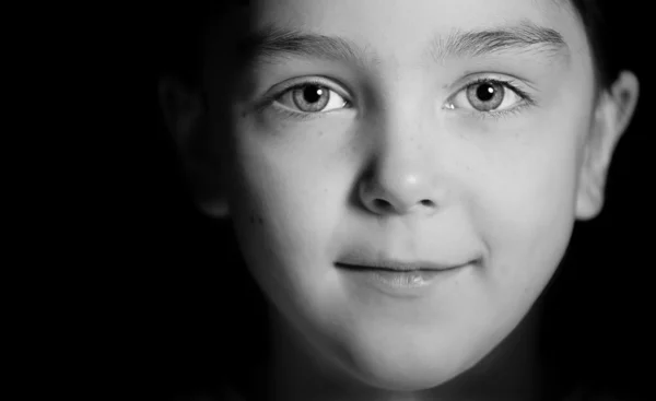 stock image Face of a child on a black background.