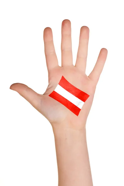 A bandeira austríaca pintada na palma da mão . — Fotografia de Stock